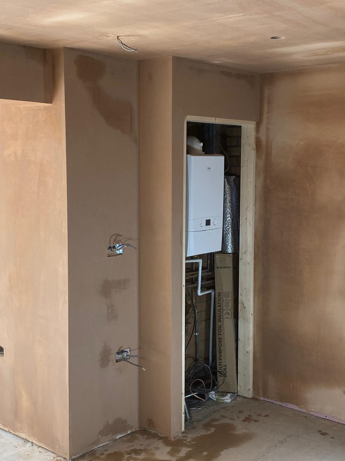 Plastered walls with boxed-in boiler cupboard